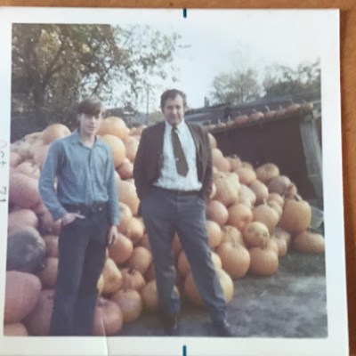 a group of people standing in front of a box