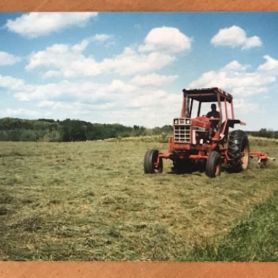 a truck driving down a dirt road