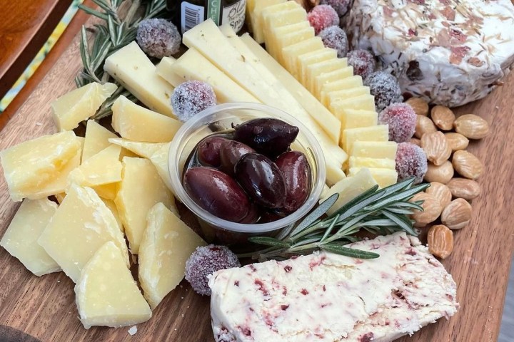 a wooden table topped with different types of food